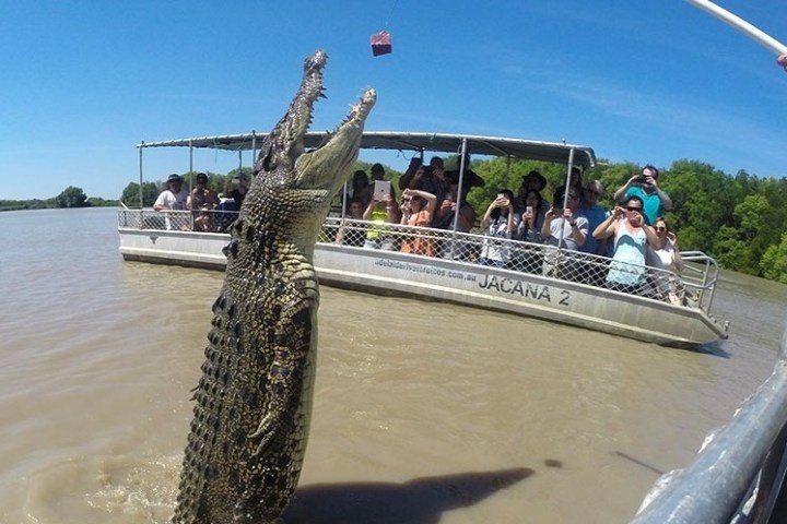 a group of people on a boat in a body of water