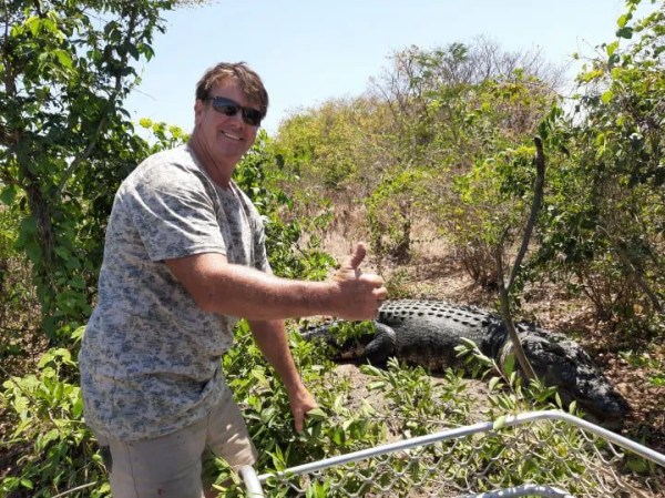 a man holding an animal